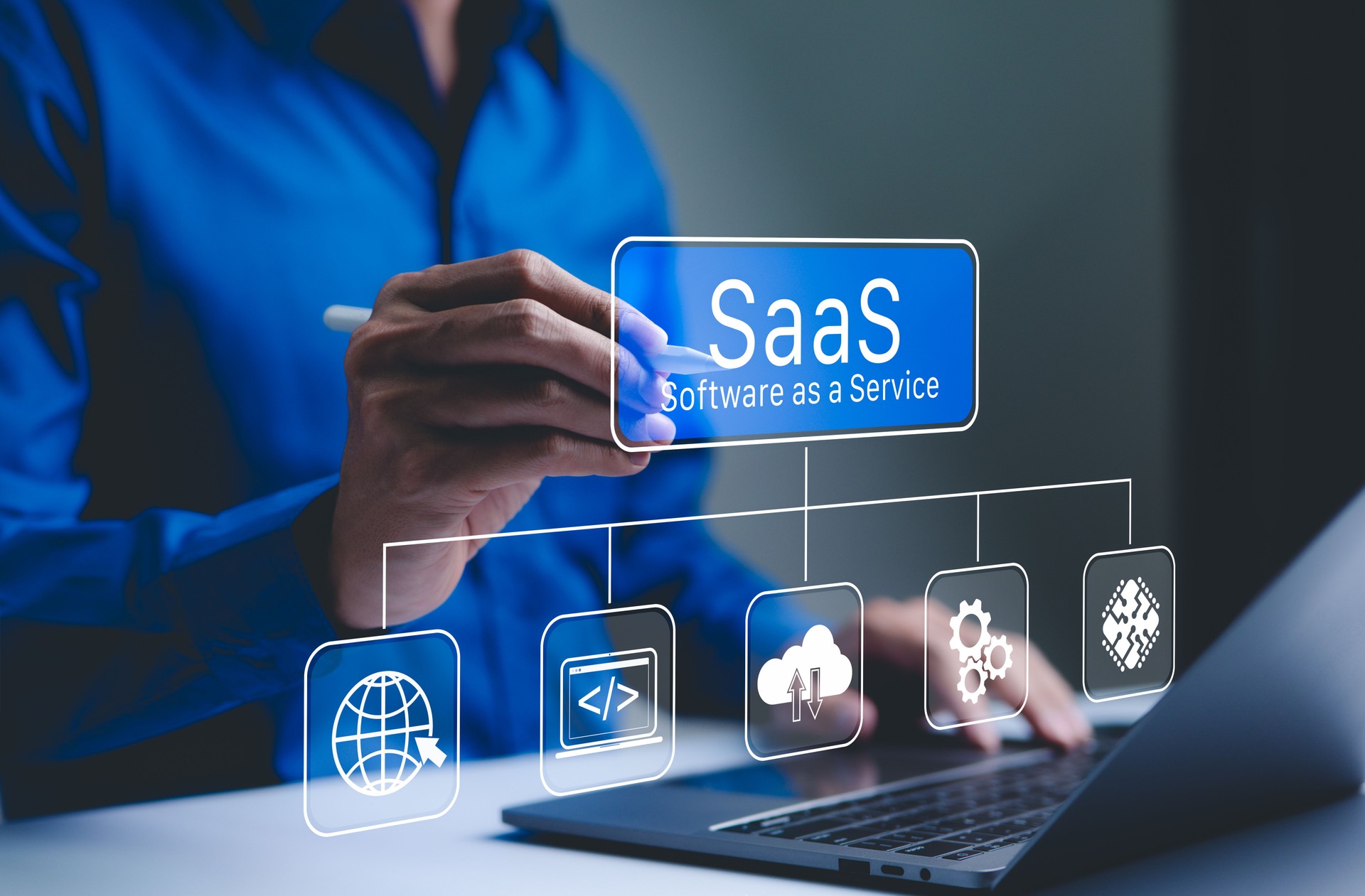 SaaS CA person interacts with a digital interface SaaS (Software as a Service) and various cloud-based icons, represent software management and cloud computing services.